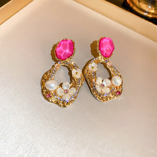 Rhinestone and flower embellished earrings