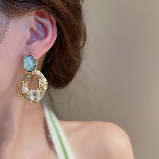 Rhinestone and flower embellished earrings