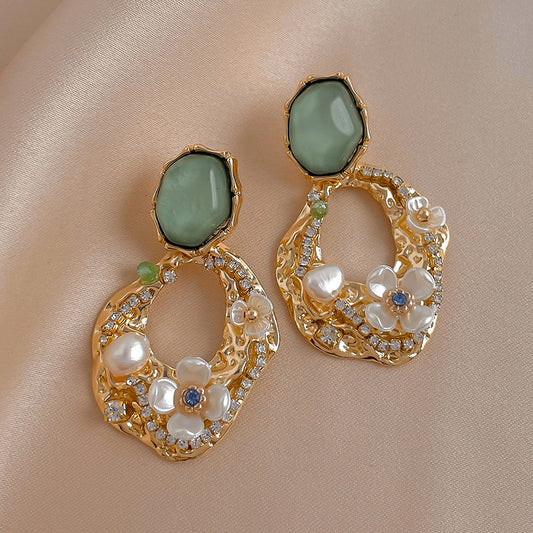 Rhinestone and flower embellished earrings