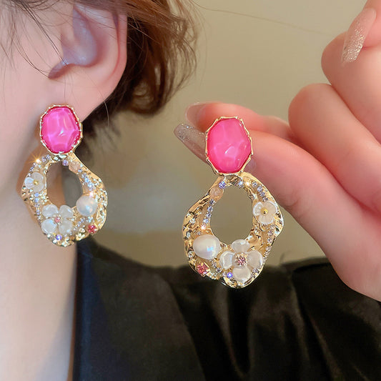 Rhinestone and flower embellished earrings